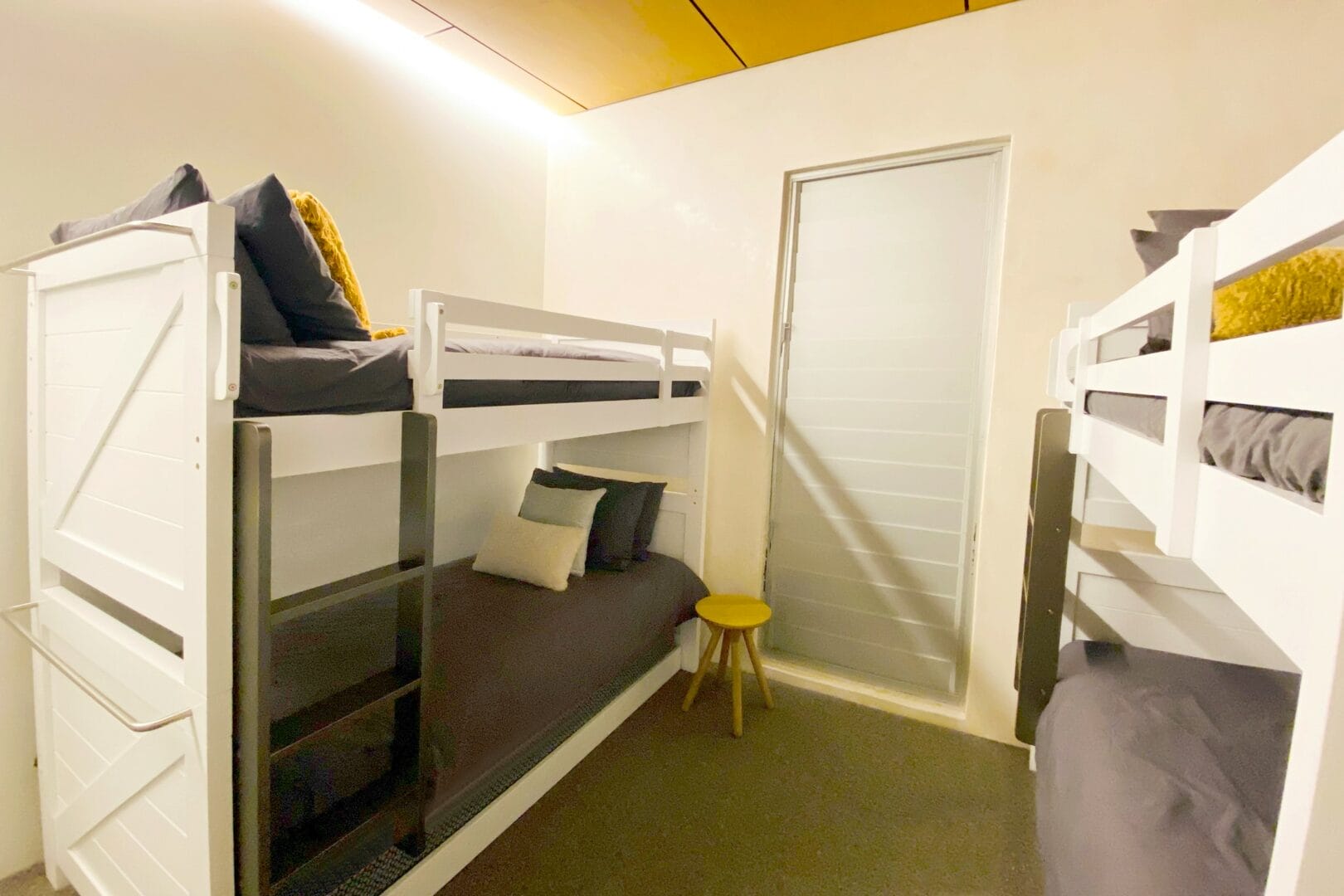 Bunk room with two sets of double bunks