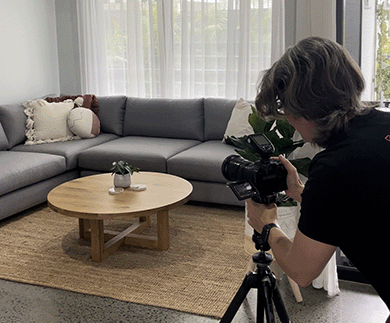 Photographs being taken of a lounge room