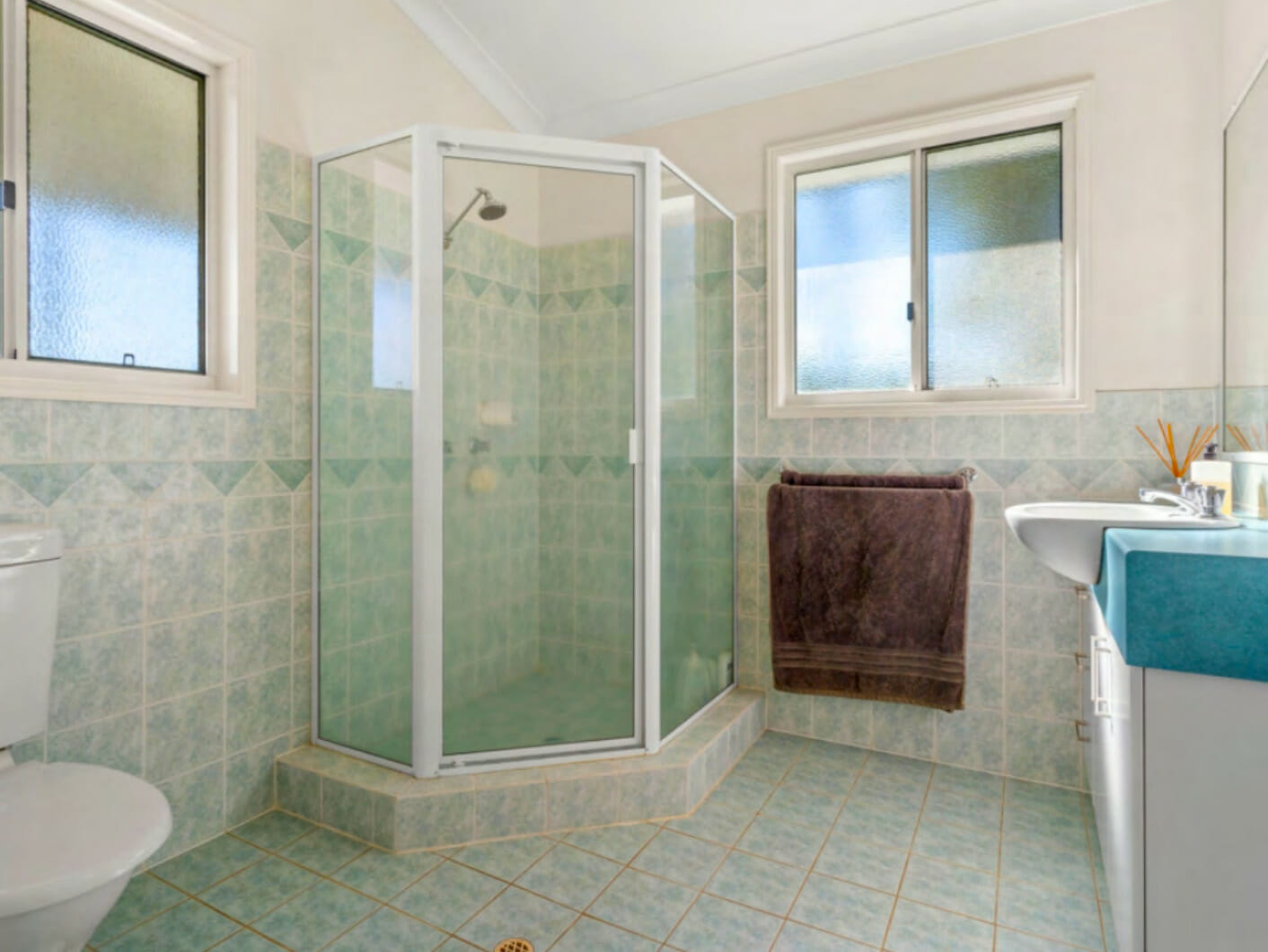 bathroom with glass shower enclosure