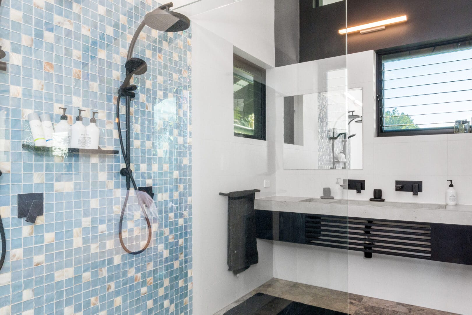Shower stall with pretty blue tiles